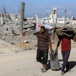 Aid Trucks Roll Into Gaza As Dispute Over Hostage Bodies Is Paused